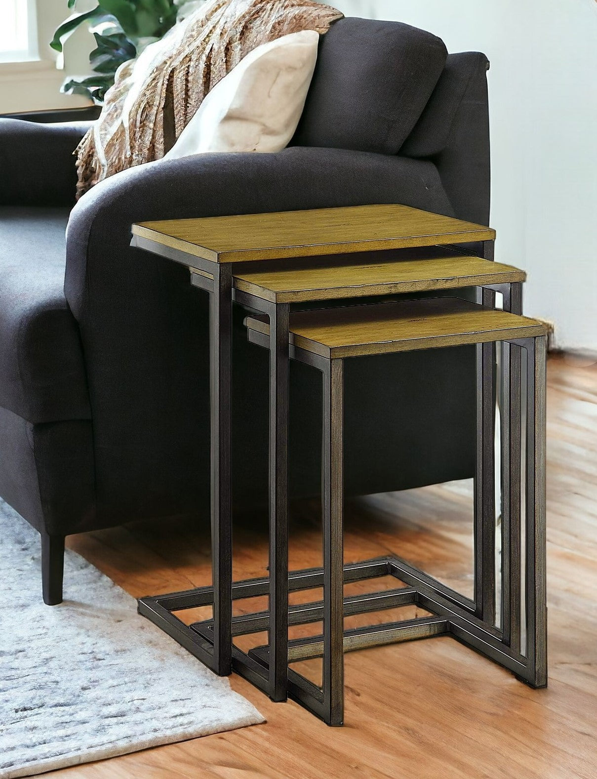 Set of Three Brown and Black Distressed Solid Wood and Steel Frame Nested Tables-1